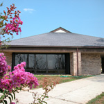 Purple crepe myrtle bloom in front of the Naval Live Oaks Visitor Center.