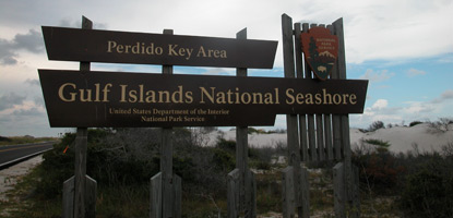 Brown National Park Service entrance sign at Perdido Key welcomes visitors.