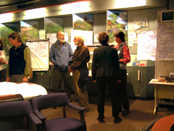 People in visitor center for public scoping meeting