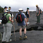 Ranger Adrian Boone shares insights on a ranger-led walk over the lava fields on the Pu`uhuluhulu Trail.
