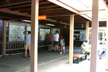 Visitors browse through the exhibits on the patio outside the visitor center. Visitors browse through the exhibits on the patio outside the visitor center.