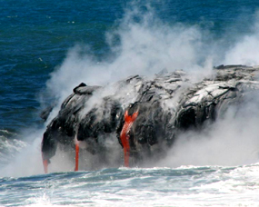 Streams of lava drip into the ocean