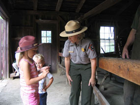A Junior Ranger candidate interviews a park ranger. A Junior Ranger candidate interviews a park ranger.