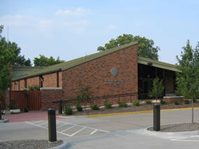 Red brick visitor center with picture windows.