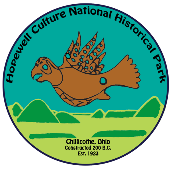 Park logo showing caricatures of copper bird and mounds