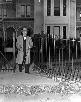 Harry Truman exits front gate of Truman Home.
