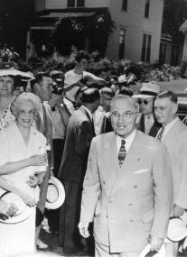 Truman with crowd in front of Truman Home. Truman with crowd in front of Truman Home.