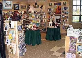 inside a store with racks and shelves full of products