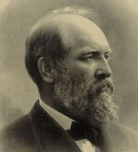 a beige tinned profile of President Garfield