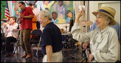Visitors dance to a traditional jazz performance