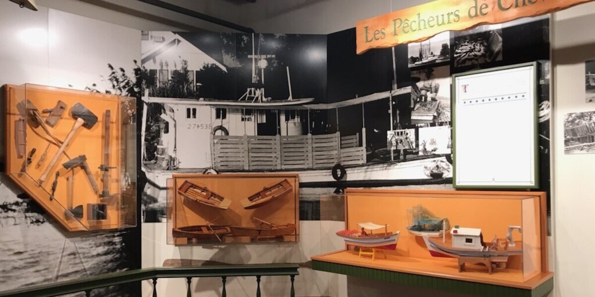 Museum display of boats at the Wetlands Acadian Cultural Center