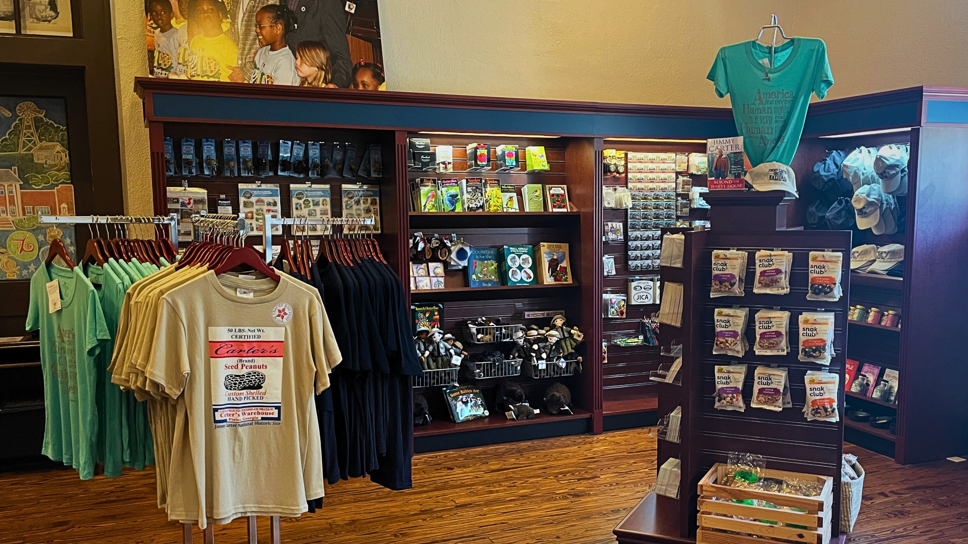 Park store with t-shirts, hats, books, and other educational items for sale.