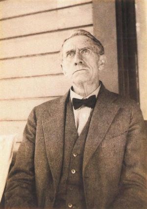A man with a suit and bowtie.