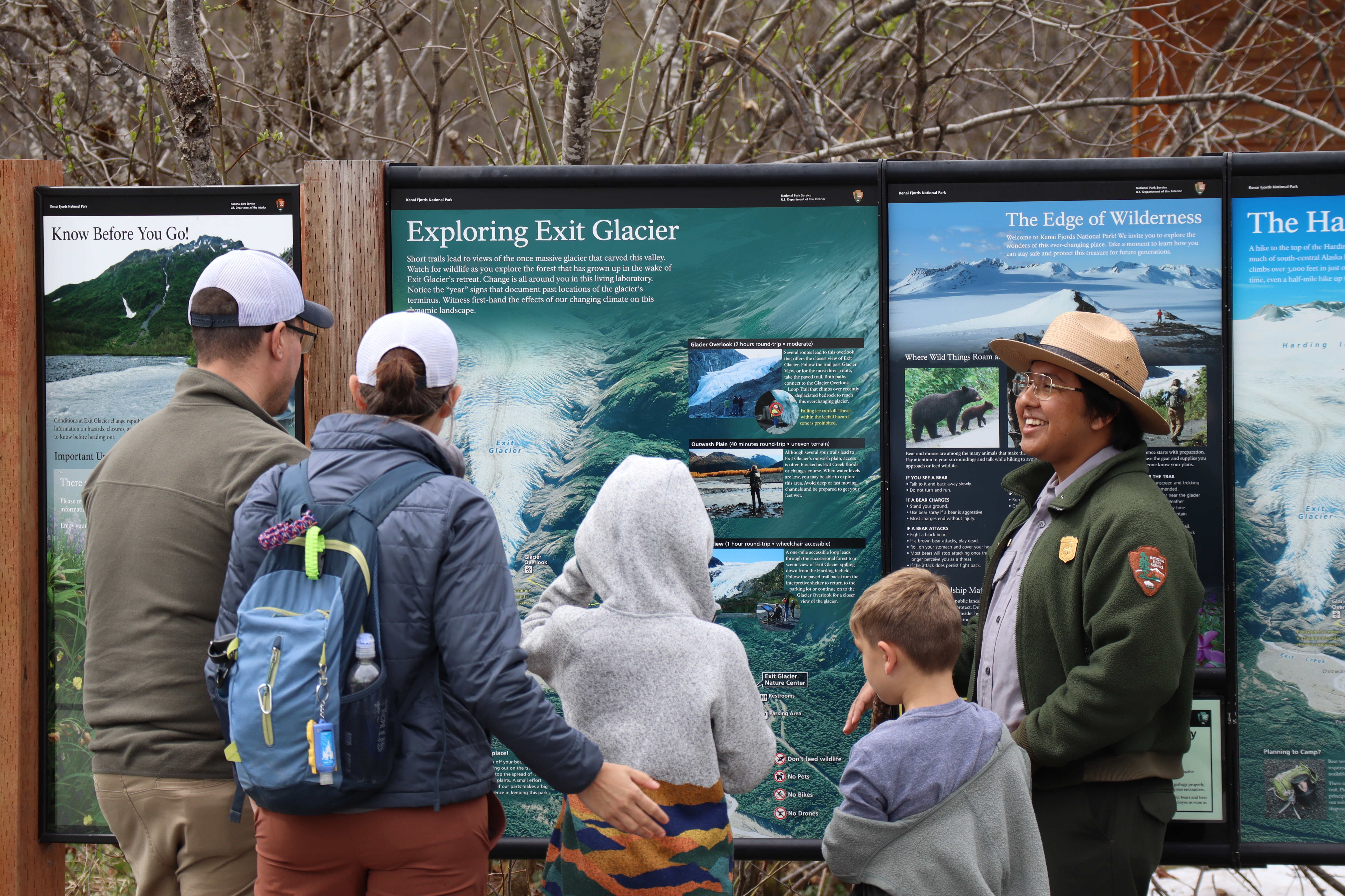 Ranger with visitors at map board