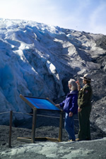 Park Ranger and visitor at the Edge of the Glacier viewpoint Park Ranger and visitor at the Edge of the Glacier viewpoint