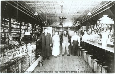 Five people pose for a photograph in a store.