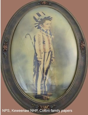 A boy dressed in an "Uncle Sam" outfit.