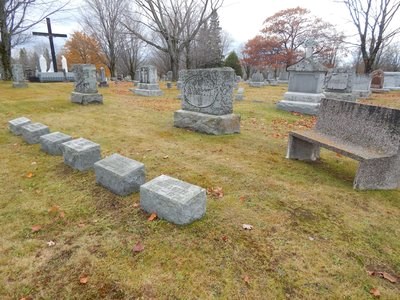 A collection of grave markers in a cemetery.