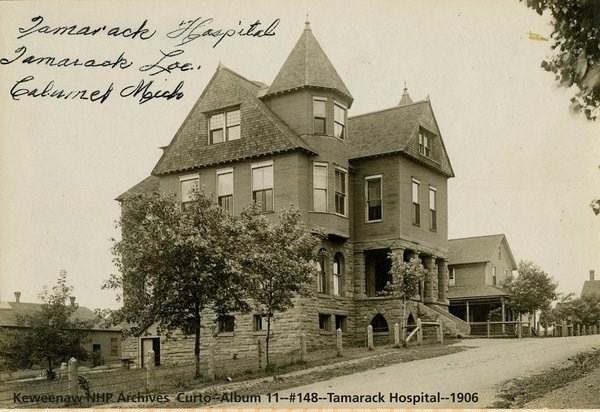 A three-story Queen-Anne style hospital building.