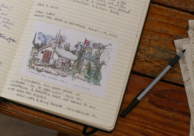 Close up of trail journal with water color illustration