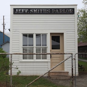 Building with large sign reading "Jeff. Smiths Parlor"