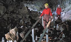 Visitors enter Indian Wells cave.