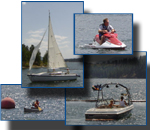 A sail boat, PWC, motor boat and canoe on Lake Roosevelt.
