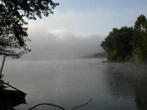 Ohio River with fog rising off the surface of the water.