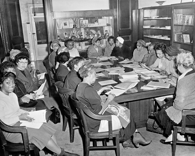 Boardroom meeting with doll display