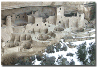 View of Cliff Palace with snow at the base of the alcove