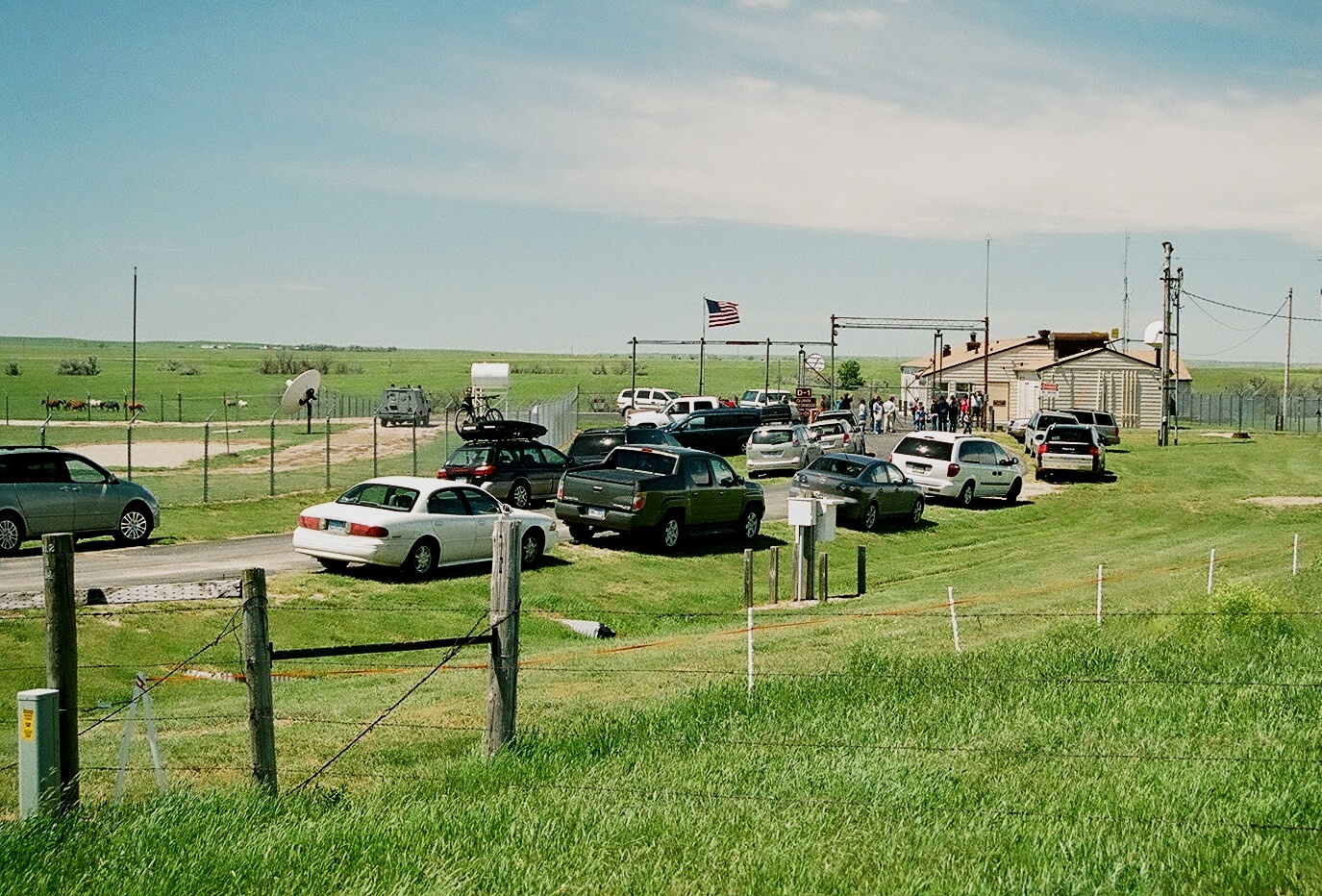 Visitors cars outside of Delta-01 at a summer open house