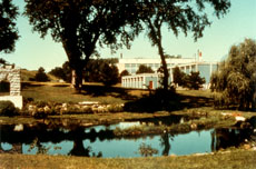Coldwater Spring flows into the reservoir with the spring house at left and Building 1 at right.