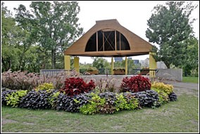 Flowers frame a gazebo in the background at Father Hennepin Bluffs Park.