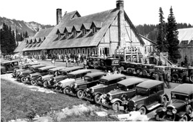 The historic Paradise Inn with old fashioned cars parked in front. 