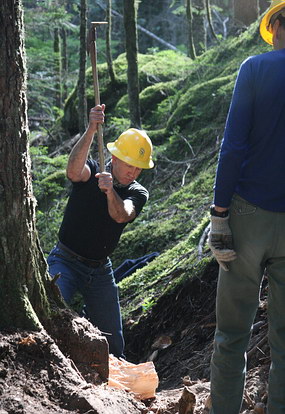 A volunteer works on Wonderland Trail repair