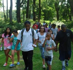 Youth Conservation Corps member leading middle school students on a hike in Jockey Hollow.