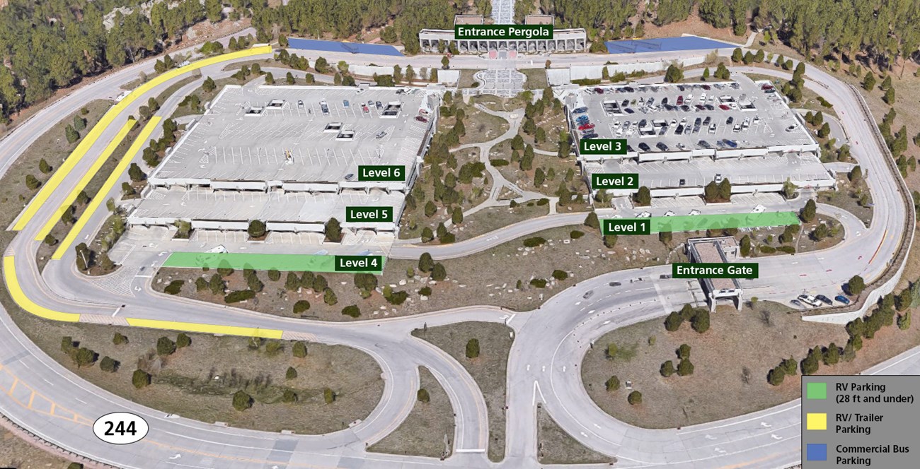 Overhead view of the parking facility.  Access roads circle the outside of the parking facility.  Levels One, Two and Three are on the right side, levels Four, Five and Six are on the left.  Mount Rushmore is out of view towards the top of the image.