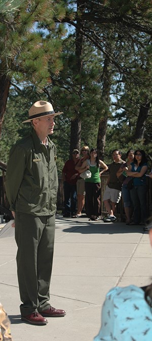 A park ranger presenting a ranger talk along the Presidential Trail.
