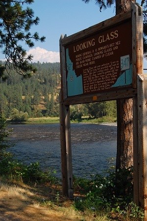 An interpretive sign with the words 'Looking Glass' with the river in the background.