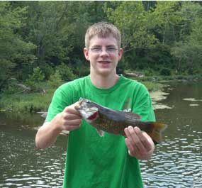Fisherman holding smallmouth bass