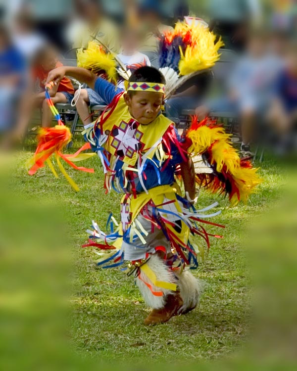 Child dancing in native regalia