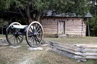 A Civil War era cannon in front of the historic Snodgrass Cabin on the Chickamunga Battlefield.