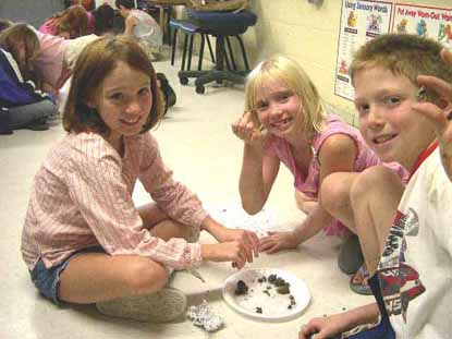 Children dissecting owl pellets