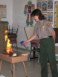 Ranger demonstrates forest fire behavior in a classroom