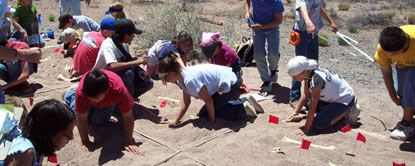 students from Taylor Intermediate working on a mock fossil excavation, NPS Photo