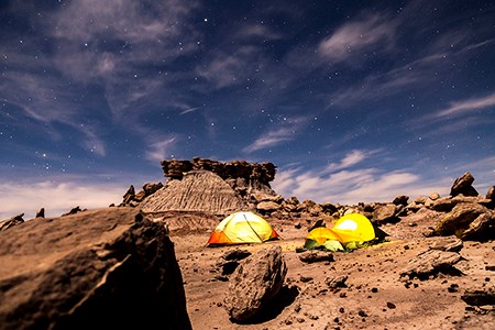 Tents glow under the stars in the Devil's Playground