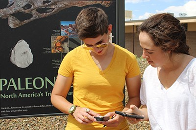 Visitors look at a geocache