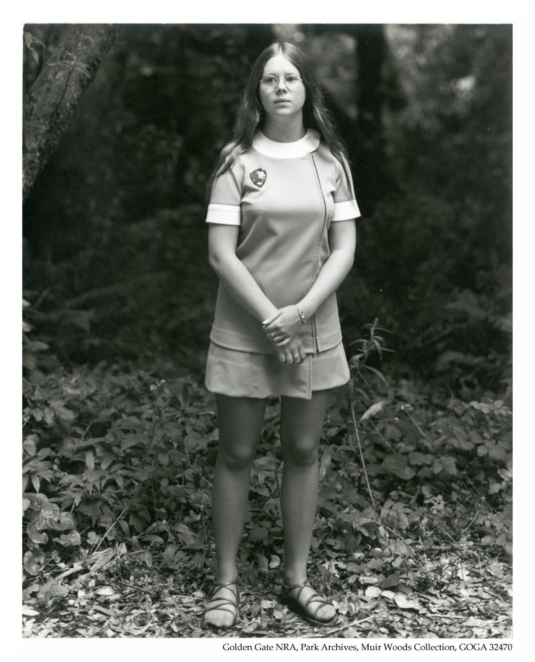 A female ranger wears an NPS uniform dress that was issued in the 1970s.