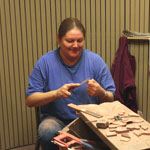 Cultural demonstrator shaping pipestone item