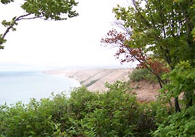 The Grand Sable Dunes tower over Lake Superior from this photo taken at the Log Slide.